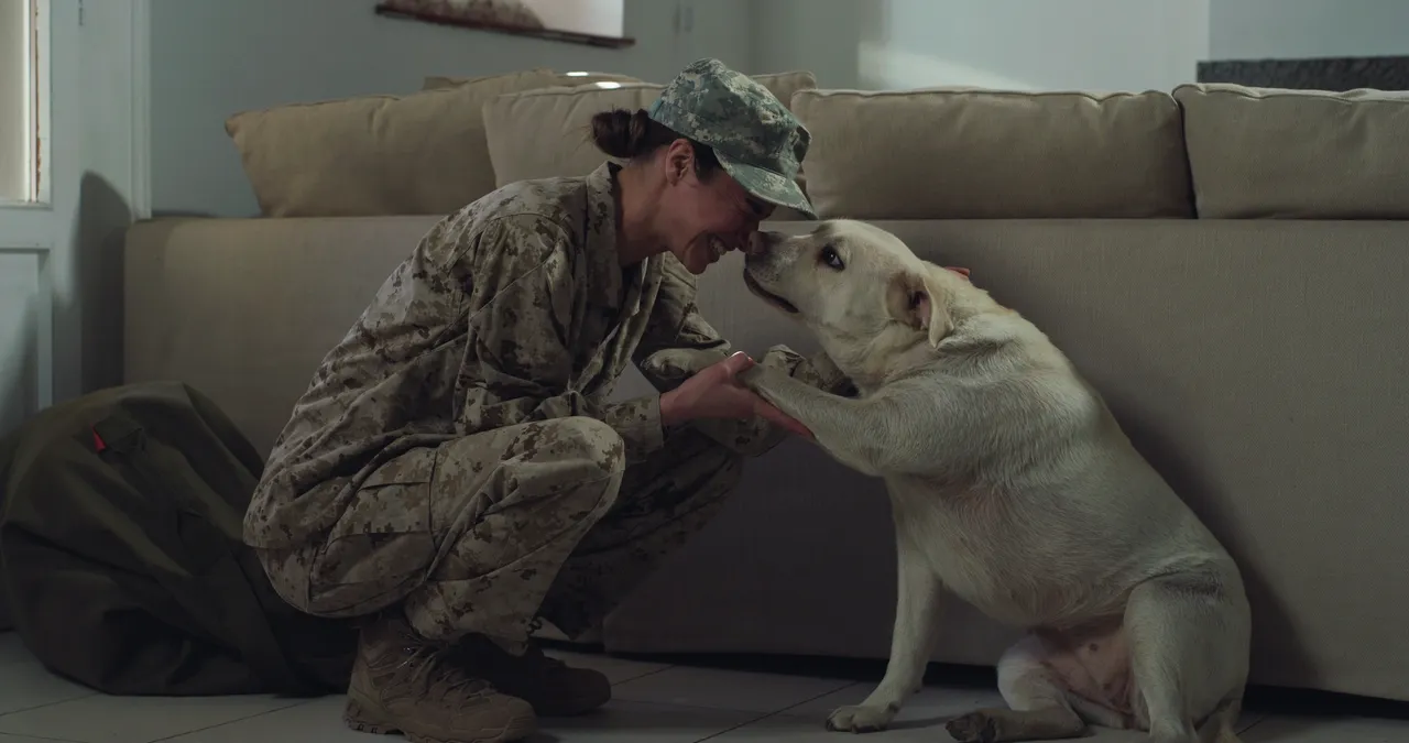Soldier at home with dog